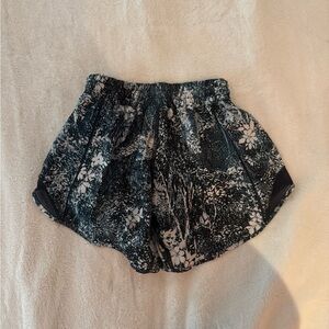 Blue lululemon shorts with white flower pattern